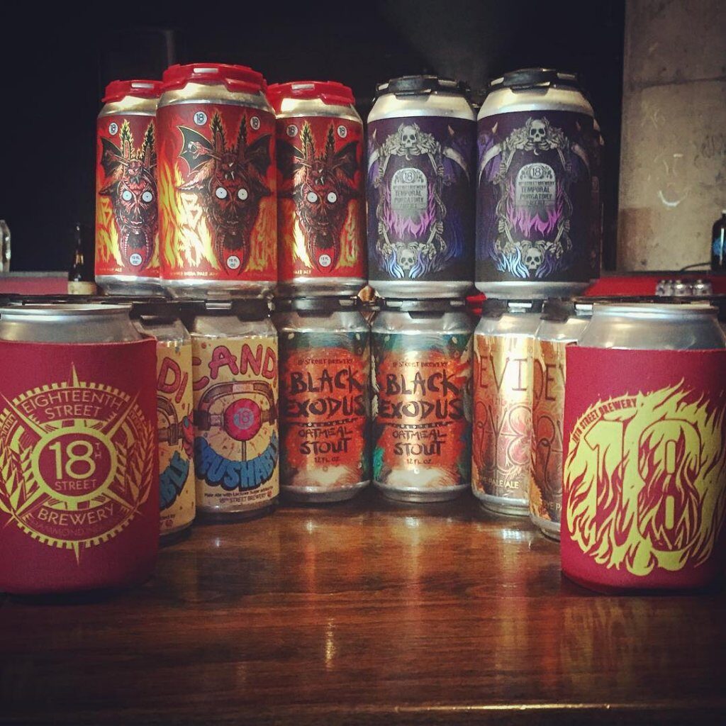 A group of 18th Street Brewery beer cans with custom-designed can labels.