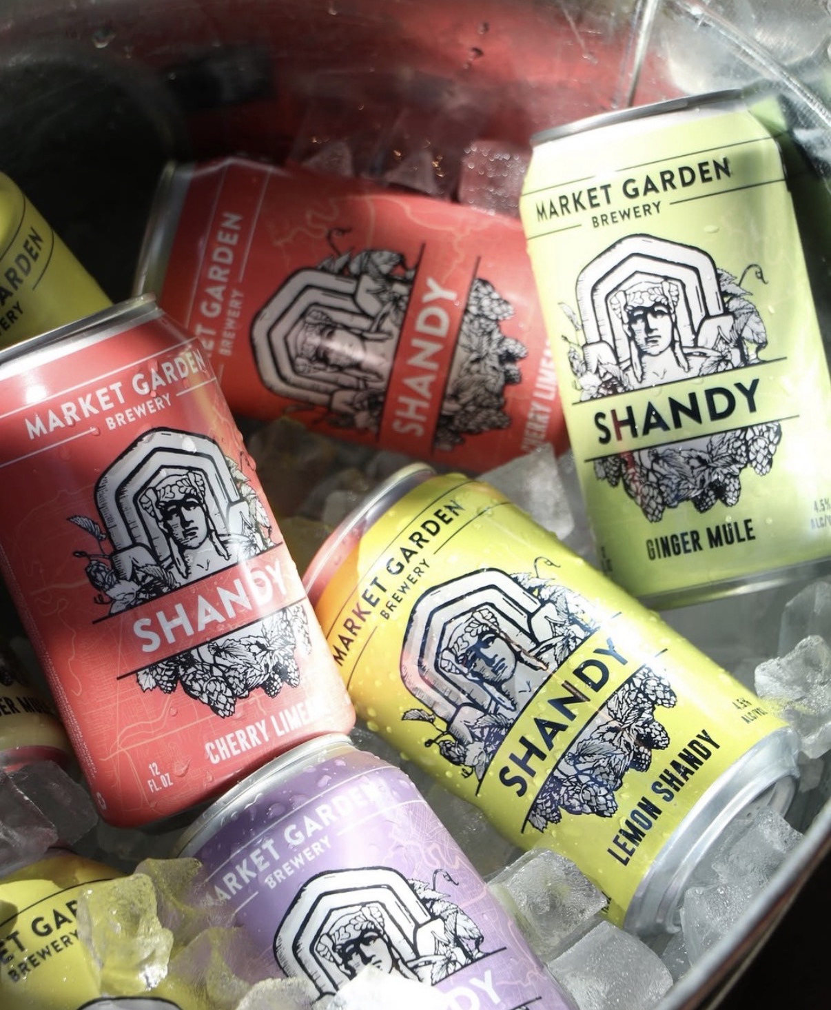 Shrink-sleeved cans chilling in an ice bucket.