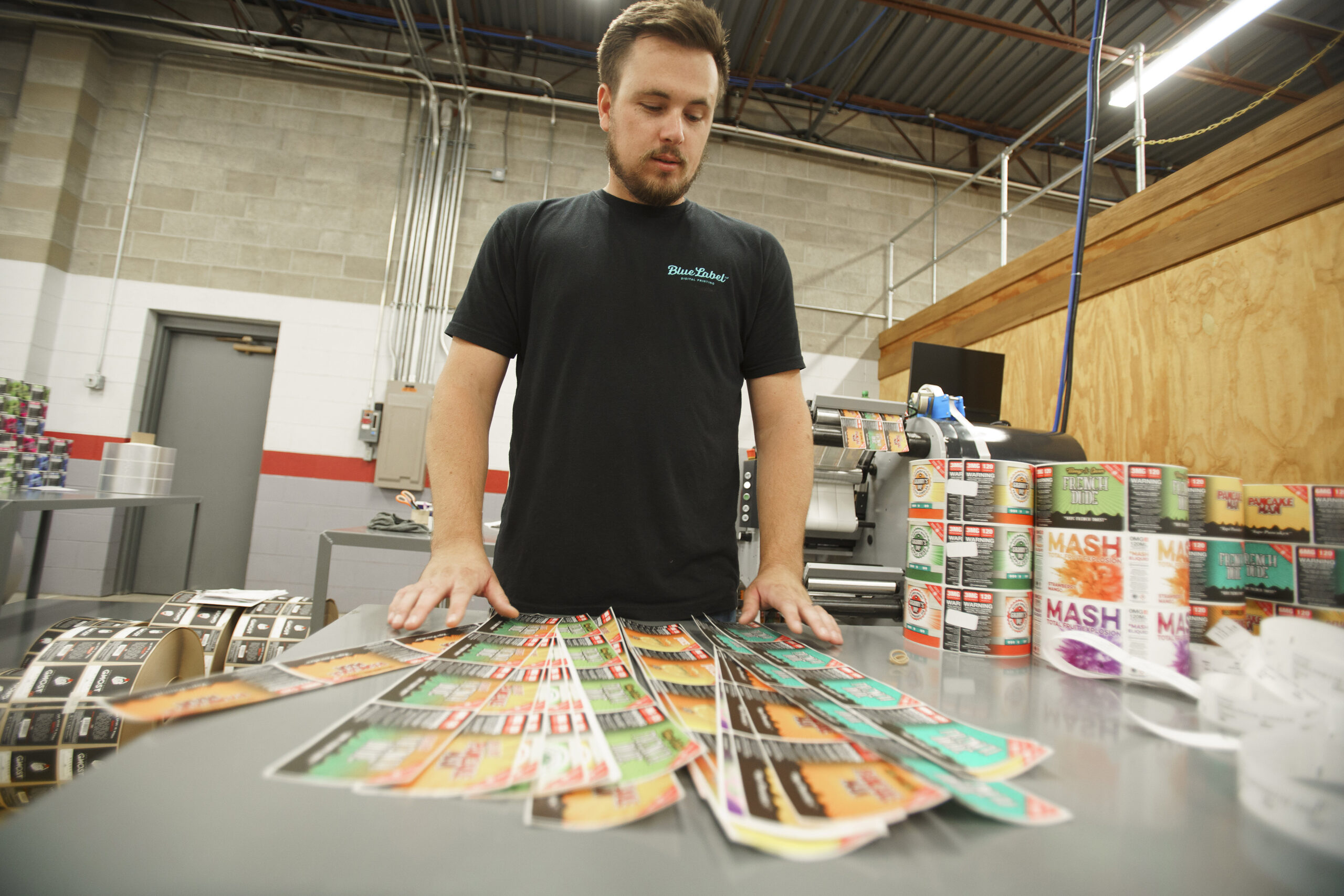 Multiple custom 7-color process labels on a table.