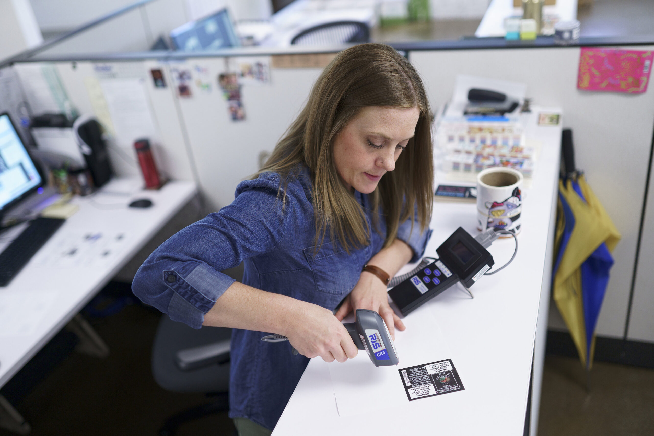 A label printing expert testing a barcode label.