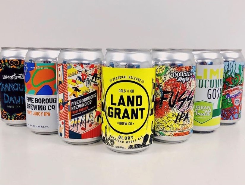 Multiple cans with custom craft beer branding.