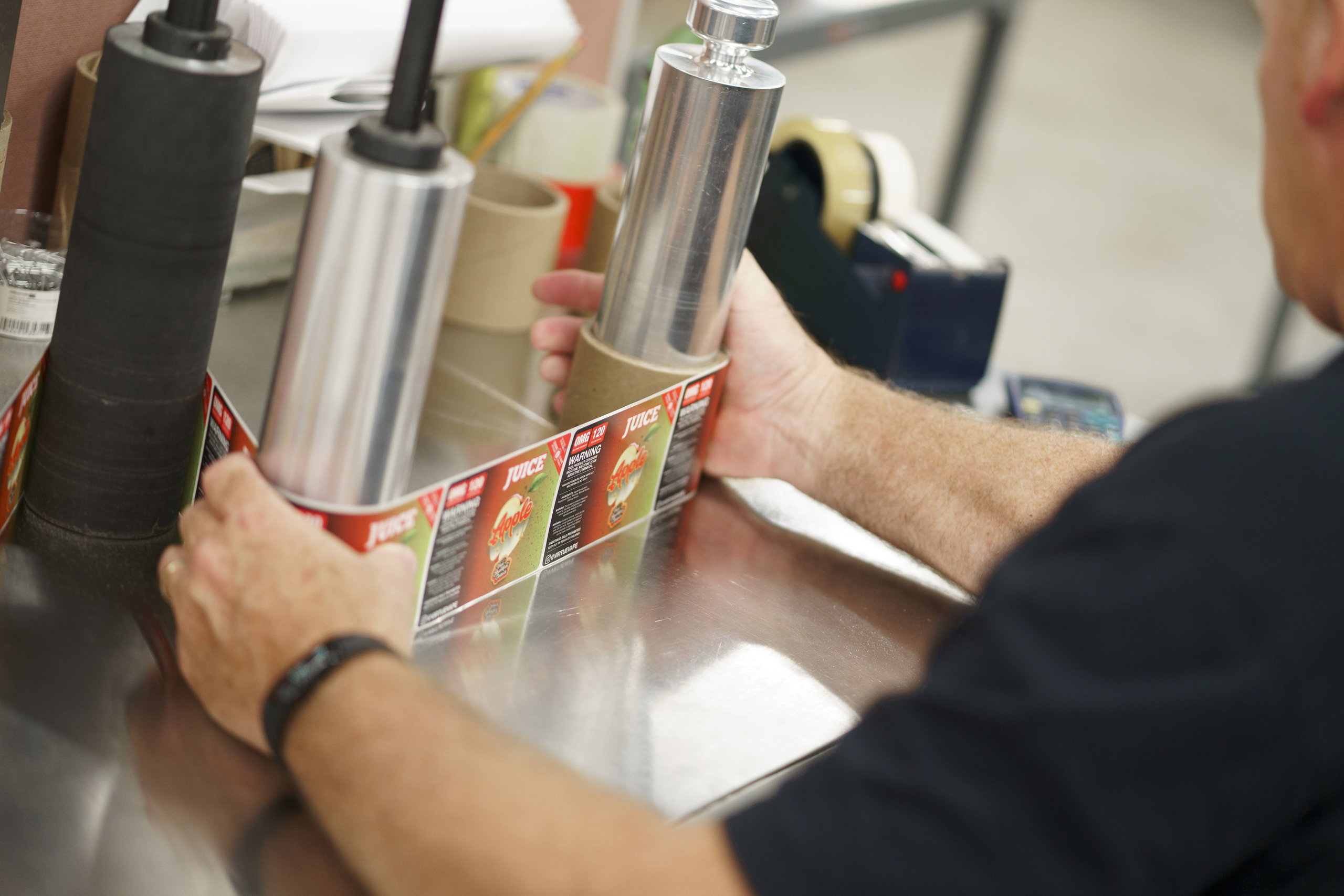 Product labels being placed on a roll for future application.