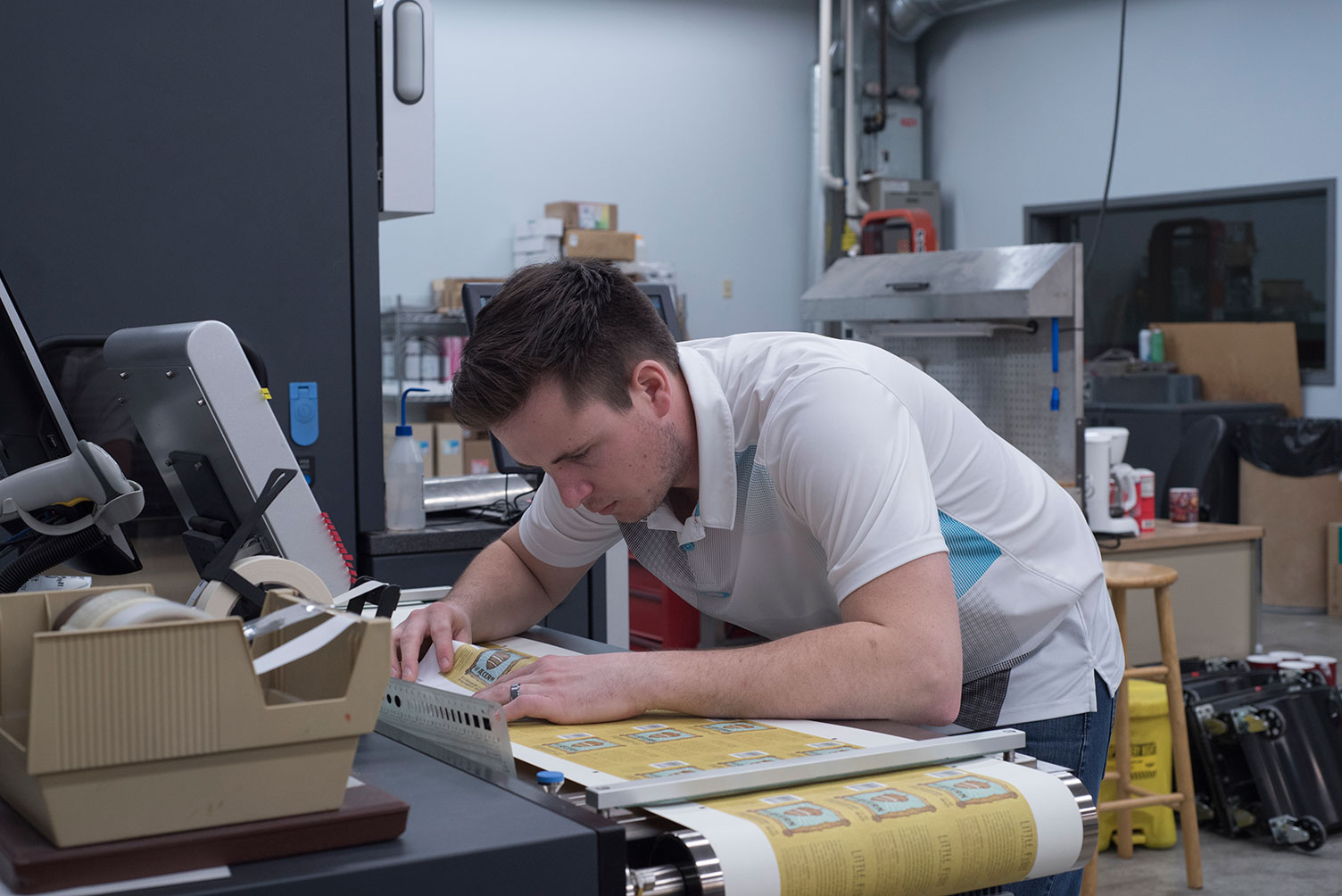 Man inspecting digitally printed beer labels.