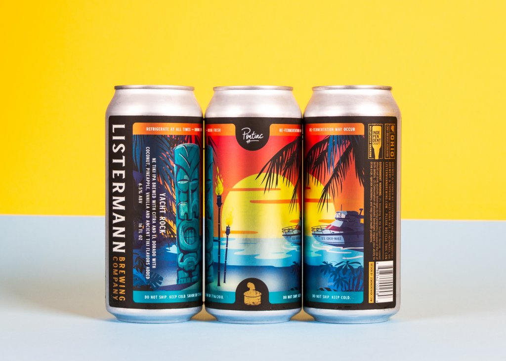 A trio of cans with colorful beer labels.