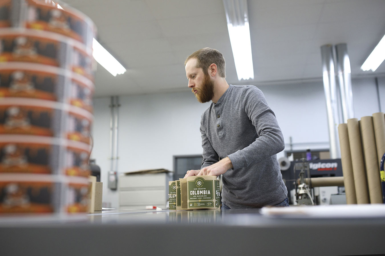 Digital printing company expert preparing labels for organic products.
