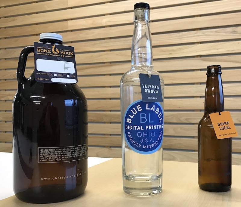 Hang tags on growler, spirits bottle, and beer bottle.