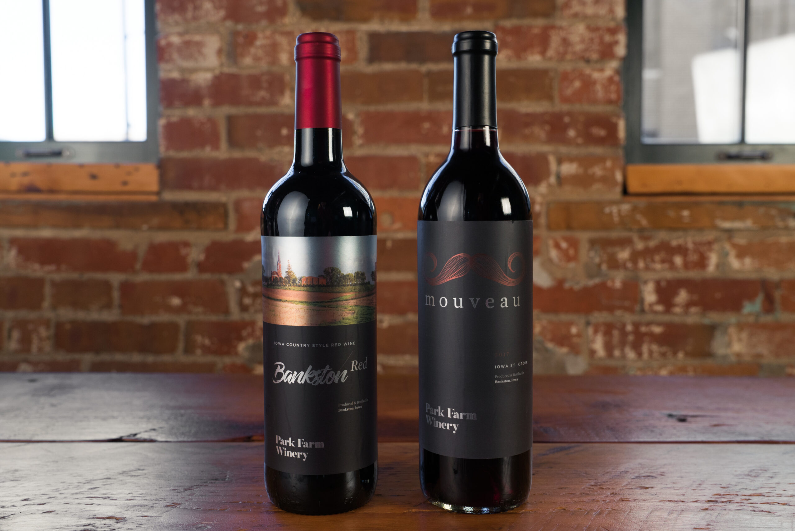 Two different types of wine listing varietals on their bottle labels.