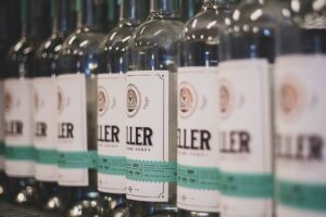 A row of bottles with product labels using ample white space.