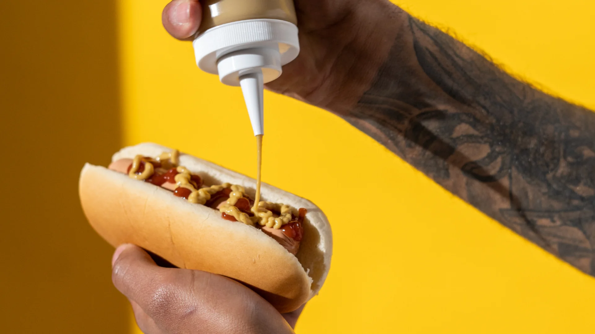 Mustard bottle and hot dog